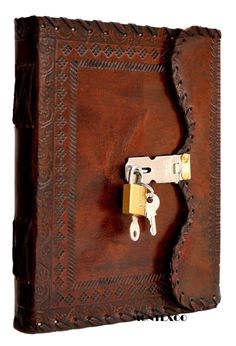 a brown leather book with a lock on the front and two keys attached to it