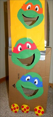 a cardboard box with teenage mutant faces on it