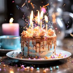 a birthday cake with lit candles and sprinkles