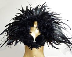 a mannequin head with black feathers on it