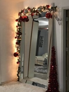 a mirror that has christmas decorations on it