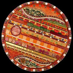 an artistically designed plate with many different colors and patterns on it's surface