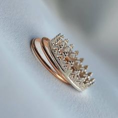 Dainty Stacking Set Of Rings. Sterling Silver Crown Ring. 14K Rose Gold Stacking Bands. Index Finger Rings. Minimalist Jewelry Gifts.  ▪︎  ▪︎  ▪︎  ▪︎  ▪︎  ▪︎  ▪︎  ▪︎ This beautiful set of stacking rings includes 3 rings in total.  x1 Crown Ring (sterling silver) x2 14K Rose Gold Filled Bands.  ▪︎  ▪︎  ▪︎  ▪︎  ▪︎  ▪︎  ▪︎  ▪︎ Please select your desired size from the drop-down menu during checkout.  More beautiful jewelry is available in my shop at: www.zyanyadesignz.etsy.com Silver 14k Rose Gold Ring As Gift, Silver-colored 14k Rose Gold Rings As Gift, Rose Gold Crown Design Ring As Gift, Rose Gold Crown Design Promise Ring, Rose Gold Ring With Crown Design, Crown Rings, Set Of Rings, Rings Minimalist, Silver Crown Ring