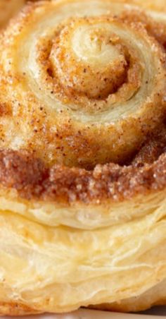 cinnamon rolls are stacked on top of each other