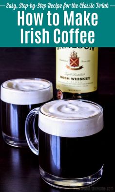 two mugs filled with irish coffee sitting on top of a table