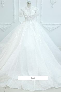 a white wedding dress on display in front of a wall with the words, c - style