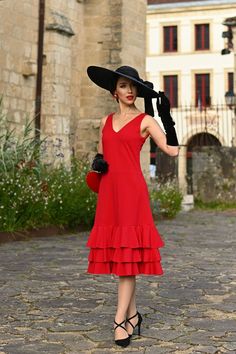 Make a statement with our stunning classic summer red dress, a true showstopper for any occasion. The dress is crafted from a luxurious, slightly elastic blend of natural and artificial fibers, giving it a substantial weight and a smooth feel against the skin.  The fitted, sleeveless design features a classic V-neckline, while the pièce de résistance is the dramatic, three-tiered flounce skirt. The result is a dress that's both elegant and playful, perfect for making a bold impression. Whether y Classic Spring Gala Dresses, Classic Summer Dress For Party, Classic Summer Party Dress, Summer Dresses For Red Carpet Events, Red Summer Dress For Red Carpet, Elegant Red Midi Dress For Gala, Red Dress For Summer Red Carpet Events, Red Dress For Red Carpet In Summer, Classic Summer Cocktail Dresses