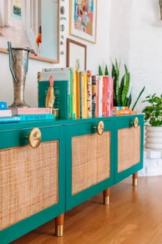 a green cabinet with some books on it