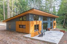 a small house in the middle of a forest