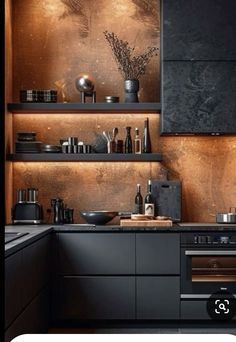 a kitchen with an oven, stove and counter top in black wood paneled cabinetry