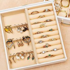 an open jewelry box filled with lots of different types of rings