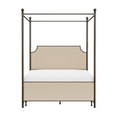 an iron bed frame with a white mattress and pillows on it, against a white background