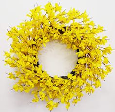 a yellow flower wreath on a white background