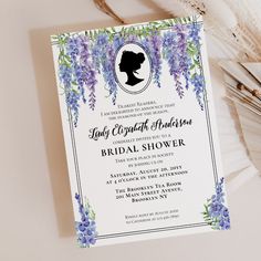 an elegant bridal shower with purple flowers and greenery on the front is shown