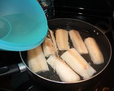 the food is being cooked in the pan on the stove