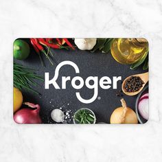 the kroger logo is surrounded by vegetables and olives on a marble surface