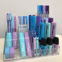 a clear container filled with lots of different types of toothbrushes