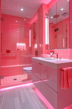 a bathroom with pink walls and floor tiles