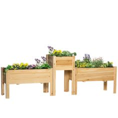 two wooden planters with plants growing out of them