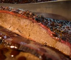 the steak is being cooked on the grill