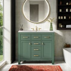 a bathroom with a sink, mirror and rug in front of the bathtub is shown