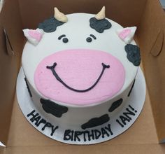 a birthday cake in the shape of a cow