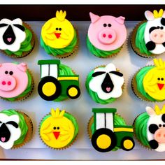 cupcakes decorated with farm animals and tractors