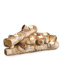 logs are stacked on top of each other with lit candles in the middle for decoration