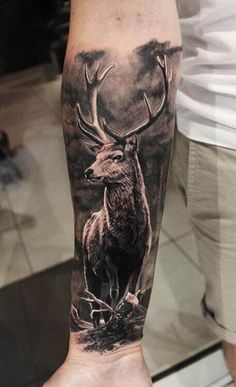 a man with a deer tattoo on his arm