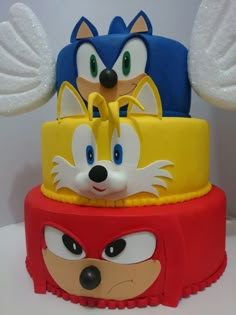 three sonic the hedgehog cakes are stacked on top of each other