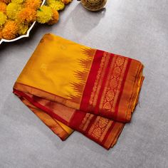 Mustard Yellow Double weave Gadwal best quality zari handwoven saree with Maroon borders exclusive | SILK MARK CERTIFIED is a mesmerizing ode to natural beauty and artistic finesse. Its Kanchi border pattern, delicately woven, evokes the serene majesty of bright landscapes. Enhanced by contrasting Maroon borders, the saree exudes a striking allure, balancing subtlety with vibrancy.  Material Gadwal silk Size 6.2 m x 1.14 m Craft Gadwal handloom Telangana Ready to wear with fall and pico done.  Handmade Designer silk tassels adorn the pallu  SILK MARK CERTIFIED Blouse - Unstitched SAREE Craft : Handwoven Pattern : All over Purity : Pure Saree Color :Mustard Saree Fabric : Fabric Silk Saree length : 5.5 Mtrs Saree Work : Woven BORDER/PALLU Saree Border Color : Maroon Saree Border Fabric :Sil Maroon Saree, M Craft, Maroon Blouse, Double Weave, Saree Border, Border Pattern, Blouse Fabric, Mustard Yellow, Borders