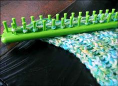 a green plastic comb sitting on top of a table