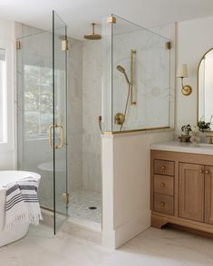 a bath room with a tub a sink and a mirror