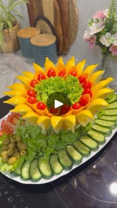 an arrangement of fruits and vegetables on a plate