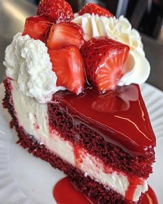 a piece of cake with strawberries on top