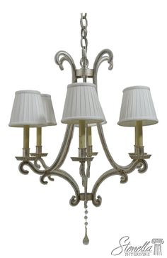 a chandelier with three lamps on it