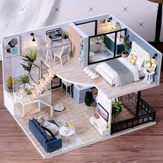 an aerial view of a dollhouse with furniture and accessories on the wooden flooring