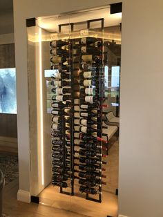 a wine rack in the corner of a room