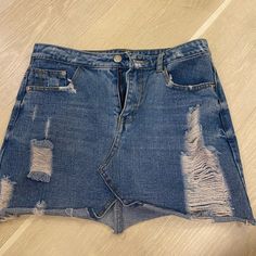 Brand New, Never Worn Distressed Jean Skirt Size Small Chic High Waist Ripped Denim Skirt, Distressed Blue Mini Skirt, Ripped Blue Denim Mini Skirt, Casual Blue Distressed Mini Skirt, Ripped Blue Mini Skirt, Blue Ripped Mini Skirt, Blue Ripped Skirt For Summer, Ripped Denim Skirt In Blue, Blue High Waist Distressed Denim Skirt