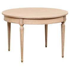 an oval wooden table with two legs