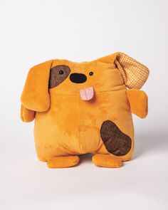 a stuffed dog with its tongue sticking out