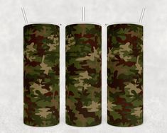 three green and brown camo cylinder lamps on a white background with the same pattern