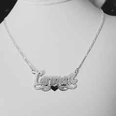 -Carmen Handmade Item. -Style: Brush Finish  -Material:  Solid 925 Sterling Silver. -Purity: Silver .925 - Link type: Figaro. -Clasp: Lobster claw. -Thickness Chains: 2.5mm. -Necklace length available: (16", 17", 18", 19", 20",21, 22"). (The name pendant is included in necklace length measurement. The necklace is laid  straight and measured end to end.) - Nameplate Letters: (Max 9 letters). Please First letter upper case and rest lower case. -Pendant Bar Measured: 1.50" Long x 0.50" Wide (38mm W Silver Hallmarked Name Necklace For Anniversary, Silver Sterling Engraved Name Necklace, Sterling Silver Hallmarked Nameplate Necklace, White Gold Sterling Silver Name Necklace With Hallmarks, Handmade Silver Nameplate Necklace, Sterling Silver Engraved Heart Pendant Necklace, Engraved Heart Pendant Name Necklace In Sterling Silver, Custom Name Silver Heart Jewelry, Silver Engraved Name Necklace For Anniversary