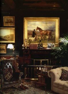 a living room filled with furniture and paintings