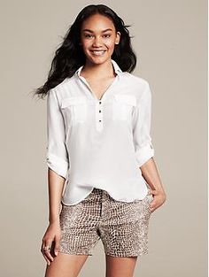 Heritage Silk Roll-Sleeve Utility Blouse Fall Blouse With Pockets And 3/4 Sleeves, Fall Business Casual Tops With Roll-up Sleeves, Casual Office Tops With Flap Pockets, Workwear Blouse With Roll-up Sleeves And Shirttail Hem, Business Casual Button-up Blouse With Roll-up Sleeves, Elegant Button-up Top With Flap Pockets, Workwear Tops With 3/4 Sleeve And Placket, Workwear Tops With Placket And 3/4 Sleeve, 3/4 Sleeve Tops With Placket For Work