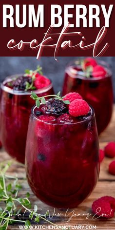 two glasses filled with raspberry souffle on top of a wooden table