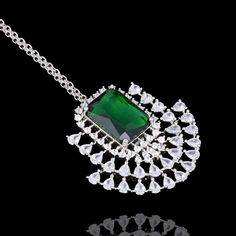 Indo western duo is here to give you that statement look - imparting elegance and grace giving its wearer the best of both worlds! Be the star of any occasion with this one of a kind set dazzled with CZ and emerald stones. The set includes a choker, a maang teekah and a pair of stud earrings. Approximate earrings length is 1". Silver-plated on high-quality brass as base metal. In-stock & ready-to-ship. *Please Note: We use faux stones and beads in all of our jewelry. Luxury American Diamond Jewelry Sets For Party, Luxury Hand Set Emerald Necklace For Parties, Silver Emerald Necklace For Party, Elegant Silver Emerald Necklace With Stone Work, Elegant Emerald Necklace With Stone Work, Dazzling Emerald Necklace With Diamonds For Parties, Hand Set Emerald Necklace With Cubic Zirconia For Party, Hand Set Cubic Zirconia Emerald Necklace For Party, Hand-set Cubic Zirconia Emerald Necklace For Party