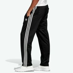 Adidas Originals Men's Firebird Track Pants New Authentic Black Features Of The Adidas Firebird Track Pants Men's 100% Polyester Tricot Ankle Zips Imported Description Of The Adidas Firebird Track Pants Men's: An Iconic Warm-Up Style Takes To The Streets. These Track Pants Honor Their '90s Roots With A Casual Fit And Classic Build Made Of Polyester Tricot. Adidas Track Pants Outfit, Adidas Pants Outfit, Adidas Trousers, Track Pants Outfit, Adidas Hose, Track Pants Mens, Pants Outfit Men, Pants Adidas, Classy Outfits Men