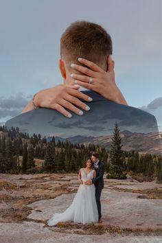 a man and woman standing next to each other with their hands on the back of their heads