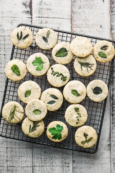 cookies with herbs and leaves on a cooling rack